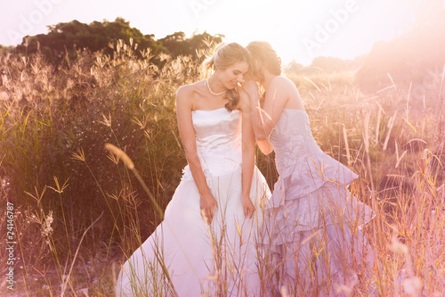 Photo: Smiling Young Bride Listening To A Secret Smiling Young Bride Listening To A Secret
