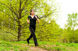 young woman running in forest young woman running in forest