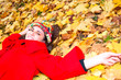 portrait of young smiling woman resting on leaves portrait of young smiling woman resting on leaves