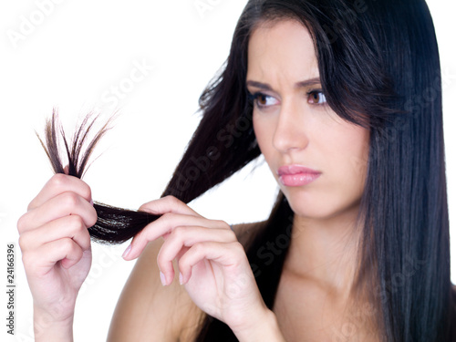 Photo: Woman in sad because of tangled hair Woman in sad because of tangled hair