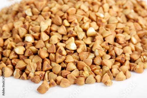 Photo: Buckwheat seeds closeup isolated on white Buckwheat seeds closeup isolated on white