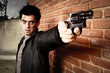 Man with gun in an alley