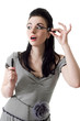 Portrait of pretty young pin-up woman applying mascara using las Portrait of pretty young pin-up woman applying mascara using las