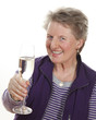 Foto: Smiling elderly lady with champagne glass Smiling elderly lady with champagne glass