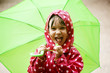 Little girl walking in the rain
