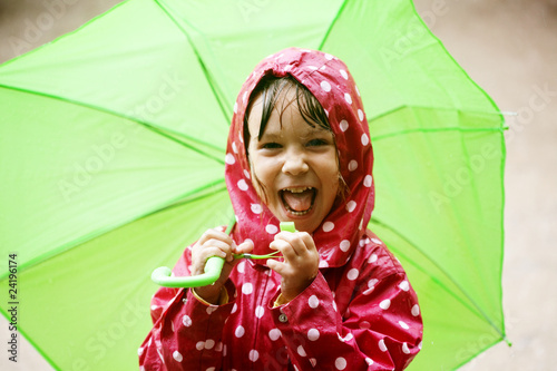 Photo: Little girl walking in the rain Little girl walking in the rain