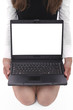 Young sitting woman holding a laptop with the white screen Young sitting woman holding a laptop with the white screen