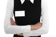 A woman wears a blank name tag. A woman wears a blank name tag.