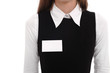 A woman wears a blank name tag. A woman wears a blank name tag.