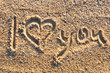 I love you message written in golden sand I love you message written in golden sand