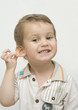 Funny glad baby boy showing the ear Funny glad baby boy showing the ear