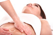 Young woman having stomach massage.