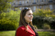 Portrait of a young woman outdoors, smiling