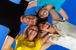 The four friends, embracing, has formed a circle and bent over a