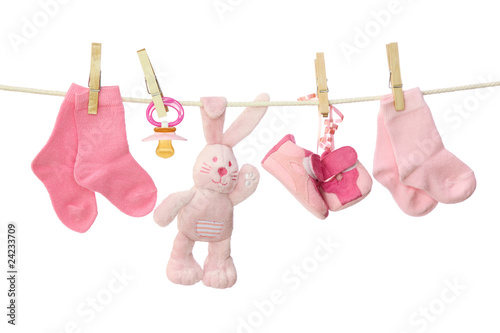 Foto: Pink baby goods hanging on the clothesline Pink baby goods hanging on the clothesline