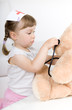 little girl doctor with teddy bear
