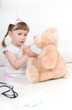 little girl doctor with teddy bear