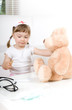 little girl doctor with teddy bear