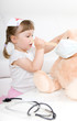 little girl doctor with teddy bear