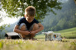 Photo: Little boy playing at camping site Little boy playing at camping site