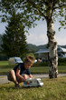 Photo: Little boy playing at camping site Little boy playing at camping site