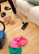A woman cleaning a living room A woman cleaning a living room