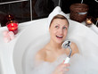 Beautiful woman singing while having a bath Beautiful woman singing while having a bath