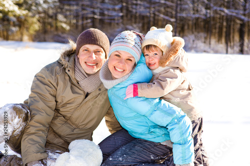Photo: Toddler and her parents in park Toddler and her parents in park