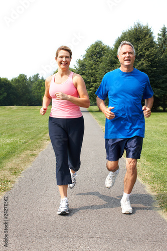 Photo: seniors couple jogging seniors couple jogging