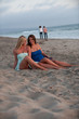 Photo: two beautiful women on California beach coast two beautiful women on California beach coast