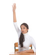 ethnic Indian schoolgirl raised hand in class