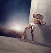 Handsome strongman over twillight urban background