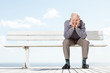 Depressed old man sitting on the bench - Outdoor