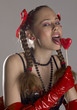 portrait of woman wearing lignerie with a lollypop