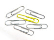 Yellow paper clip bieng ganged up on