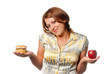Girl is chosen between apple and hamburger Girl is chosen between apple and hamburger