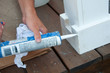 Painter Caulking Seam of Wood Trim Painter Caulking Seam of Wood Trim