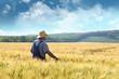 Farmer walking through a wheat field Farmer walking through a wheat field