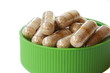 Green cap full of vitamin pills