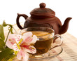 Cup of green tea on the table with orchid flower Cup of green tea on the table with orchid flower