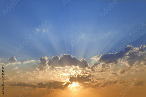 Photo: Sky at a sunset with lots of sunbeams Sky at a sunset with lots of sunbeams