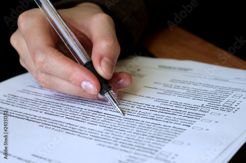 Photo: review and filling out legal contract review and filling out legal contract