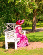 Dressed up young lady on the bench Dressed up young lady on the bench