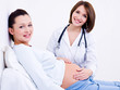 Foto: Doctor touches the belly's pregnant Doctor touches the belly's pregnant
