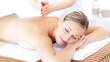 Attractive woman having a massage with massage oil Attractive woman having a massage with massage oil