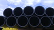 Video: Pipes stacked in construction site dolly shot Pipes stacked in construction site dolly shot