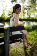 Ein Mädchen mit einem Handy im Park, Vohburg im Juli 2010 Ein Mädchen mit einem Handy im Park, Vohburg im Juli 2010