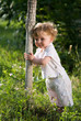 Little baby in the midle of green nature