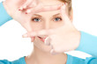lovely woman creating a frame with fingers