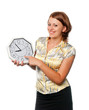 Smiling girl points a finger at clock Smiling girl points a finger at clock